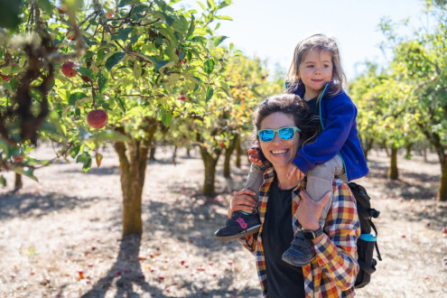 Who needs an apple picker when you've got Mama to lift you up